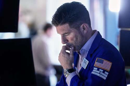 Asian shares are mixed, US futures edge higher as AI fears drag Wall Street lower