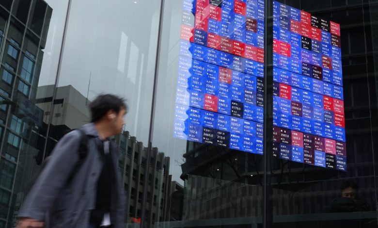 Asian stocks edge up as oil declines, dollar falls