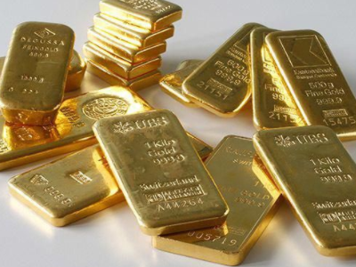 Hong Kong-listed gold stocks collectively declined as the strong US dollar pressured precious metals, with spot gold falling below USD 5,100.