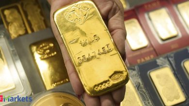Gold on track for third weekly loss on firm dollar, hawkish Fed signals