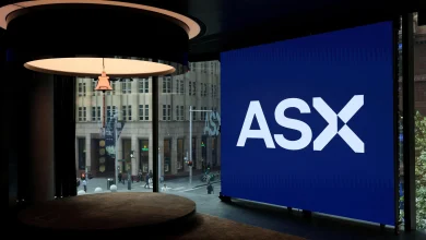Australian shares decline nearly 1% as BHP warning, rate fears hit miners, banks