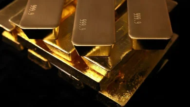 Gold falls as hawkish US Fed stokes 2026 interest-rate hike wagers