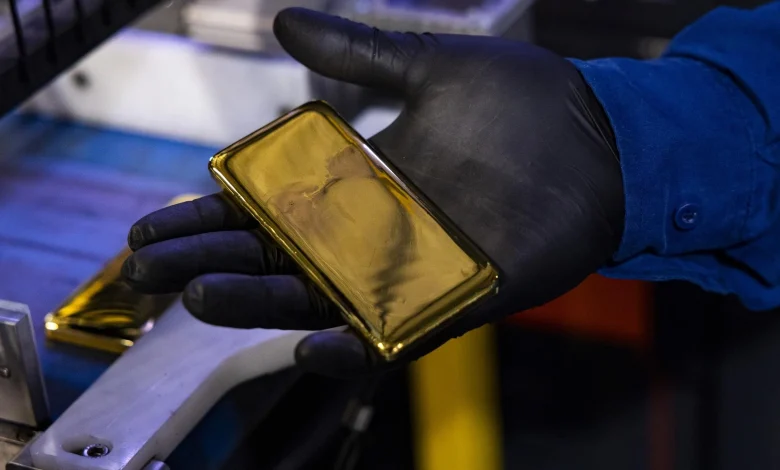 Gold trades near two-week high on cooling US rate-hike bets