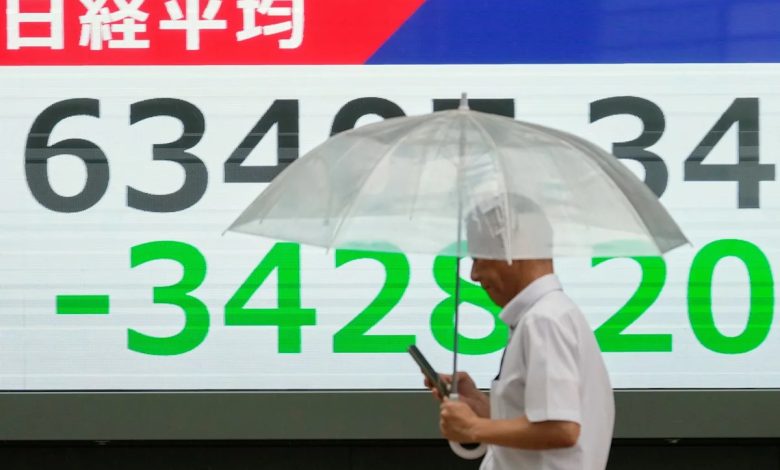 Asian shares sink, with Tokyo down nearly 5% as slumping AI stocks drag world markets lower